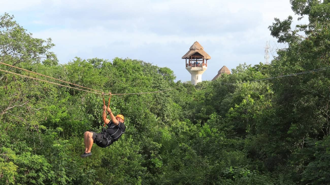 Man zip lining at Xplor Park